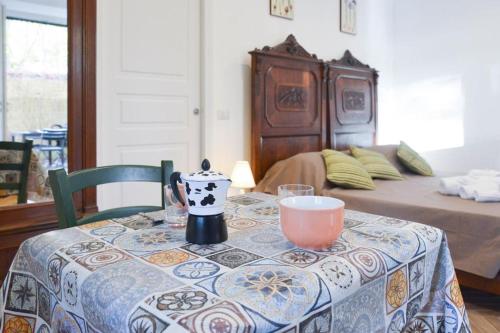 a table with a table cloth on a table with a bed at Podere Sant'Antonio da Zio Gino in Bolsena