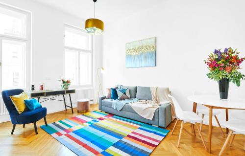 a living room with a couch and a table at Residence Dlouha - Old Town in Prague