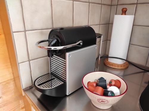 a toaster sitting on a counter next to a bowl at Apartment mit Traumblick im Haus Olympia in Grächen