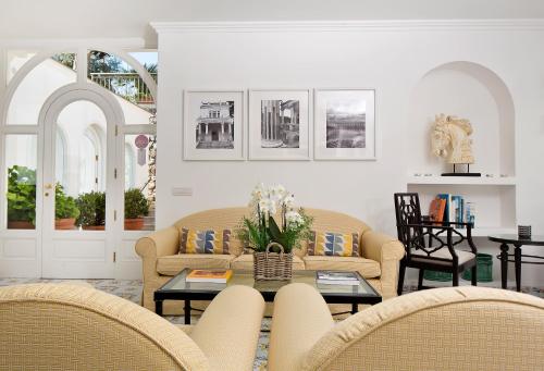 a living room with couches and a table at Hotel Canasta in Capri