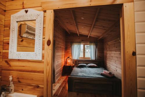 Postel nebo postele na pokoji v ubytování Ragaciema Skadiņi