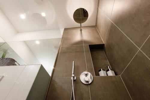 a bathroom with a shower with a toilet at Saargemünder 128 in Saarbrücken