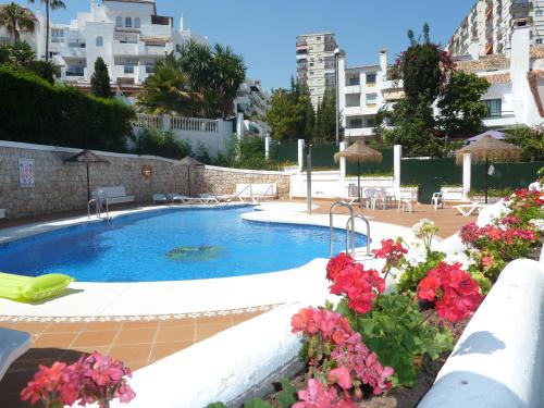 Swimmingpoolen hos eller tæt på Apartamentos Pueblo Quinta