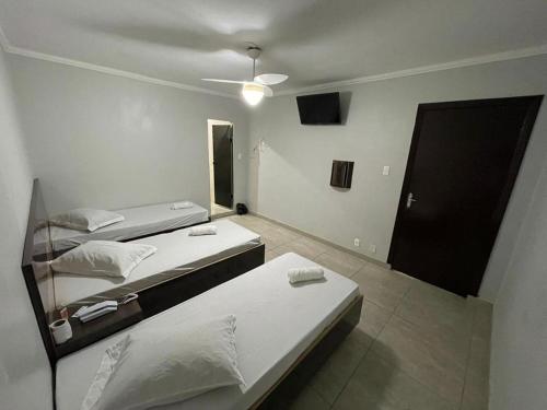 Tempat tidur dalam kamar di Hotel Ouro de Mauá