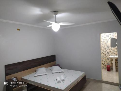 Tempat tidur dalam kamar di Hotel Ouro de Mauá