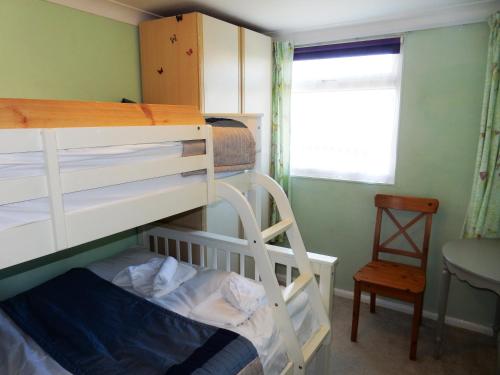 Postel nebo postele na pokoji v ubytování Dartmouth Chalet Holidays