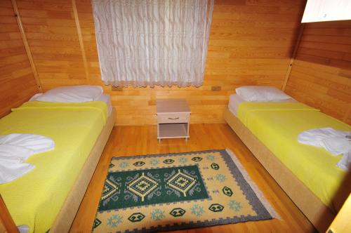 Letto o letti in una camera di Ikiz Pension Bungalow