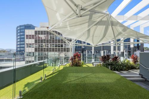 a large white canopy on top of a building at Meriton Suites Herschel Street, Brisbane in Brisbane