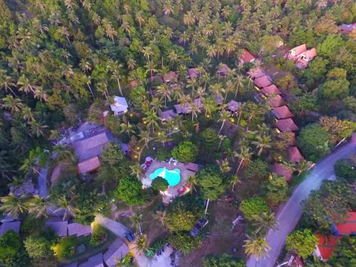 an overhead view of a house with a pool and trees at Shiralea Backpackers Resort in Haad Yao