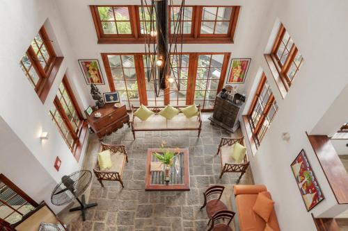 an overhead view of a living room with a couch and chairs at Gruhaya Boutique Villa in Kandy