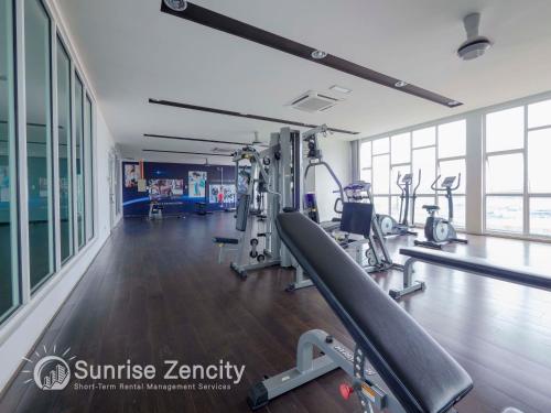 a gym with treadmills and ellipticals in a building at Seaview condo near RF Mall, Food Court & Free Netflix in Johor Bahru