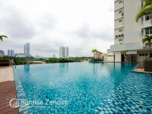 a swimming pool in the middle of a building at Seaview condo near RF Mall, Food Court & Free Netflix in Johor Bahru