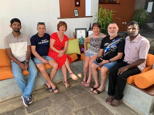 a group of people sitting on couches in a room at Gruhaya Boutique Villa in Kandy