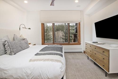 מיטה או מיטות בחדר ב-Snowlcoud 203 condo