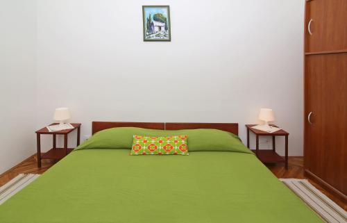 A bed or beds in a room at Dubrovnik Heritage Apartments
