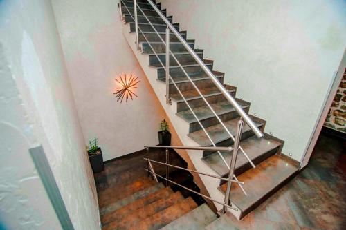 an overhead view of a metal spiral staircase at Hotel Astoria in Budva