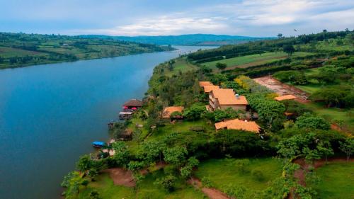 an aerial view of a house next to a river at Vintage Cottage in Rwamagana