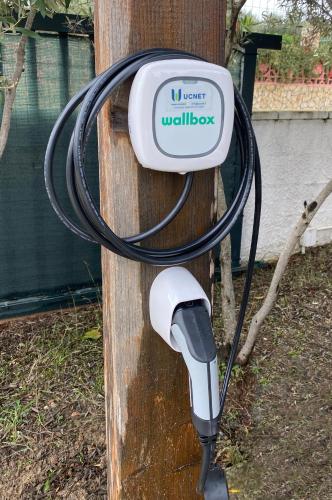 a meter on a wooden pole with a hose at La Casetta di Sù in Maracalagonis