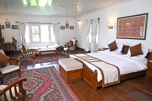 Ένα ή περισσότερα κρεβάτια σε δωμάτιο στο Tumsong Tea Retreat
