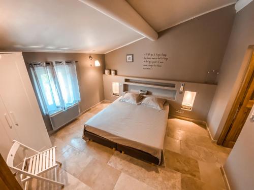 Cama ou camas em um quarto em Le Petit Rossignol