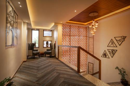 a hallway of a home with a stairway at Coral Reef Hotel & Spa, Port Blair in Port Blair