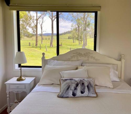 a bed with a picture of a dog on it at Stay at the Barn... Immerse yourself in nature. in Kenilworth
