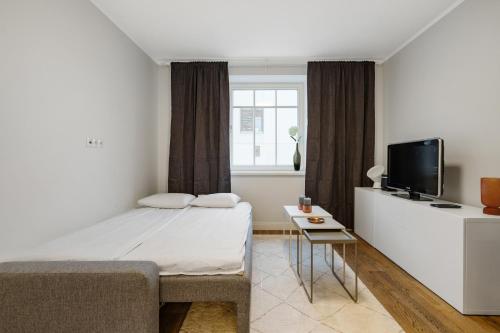 Postel nebo postele na pokoji v ubytování Charming 1BR in Superb Location, Free Parking & Wi-Fi