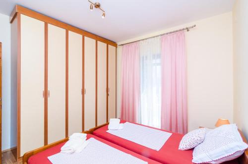Posteľ alebo postele v izbe v ubytovaní Guesthouse Somnium
