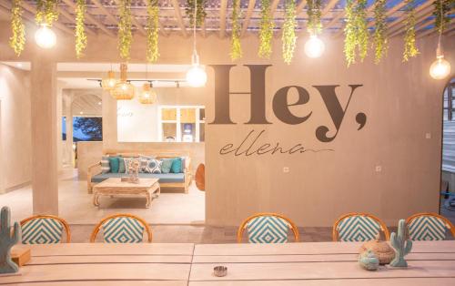 a living room with a help sign on the wall at Villa Ellena By The Villas 100 in Paragajen