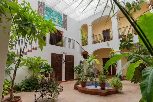 a courtyard with plants and stairs in a building at Hospedium Hotel Val de Pinares in Bogarra