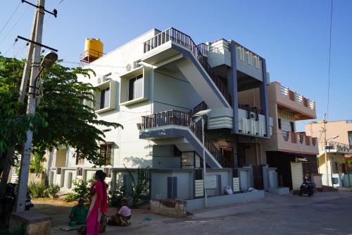 a building with a staircase on the side of it at Akash homestay in Hampi