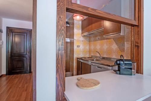 a kitchen with a sink and a counter top at Apartment center Madonna di Campiglio EM in Madonna di Campiglio