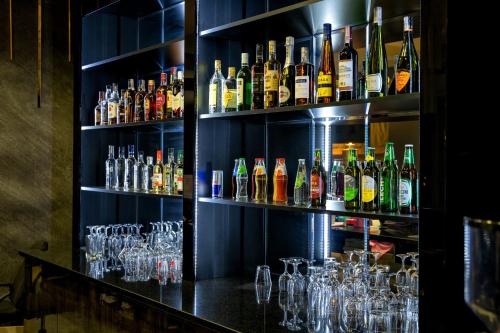 a bar filled with lots of bottles and glasses at Hotel Lord Gorlice in Gorlice
