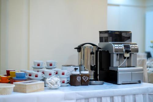 a coffee maker sitting on top of a table at Hotel Lord Gorlice in Gorlice
