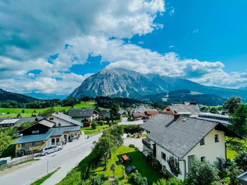 a small town with a mountain in the background at Downhill Lodge Tauplitz in Tauplitz