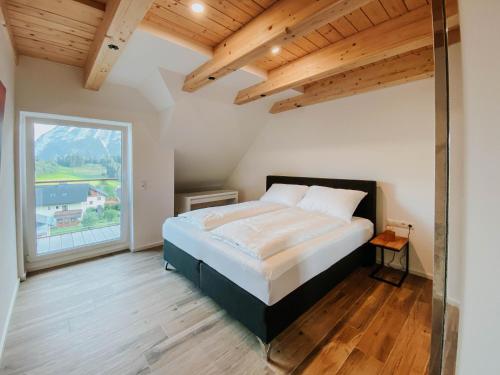 Tempat tidur dalam kamar di Downhill Lodge Tauplitz