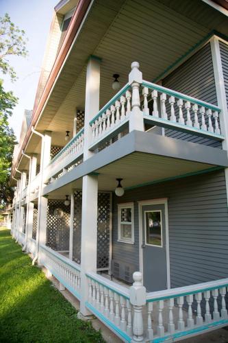 a house with a white staircase on the side of it at The Shelby Inn in Shelbyville