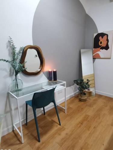 a room with a desk with a chair and a mirror at HINODE Geniehome 3BR free WIFI and CARPARK at Utropolis Shah Alam in Shah Alam