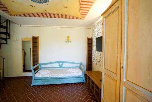 a bedroom with a bed in a room with a ceiling at Residence Le Acacie in Capoliveri