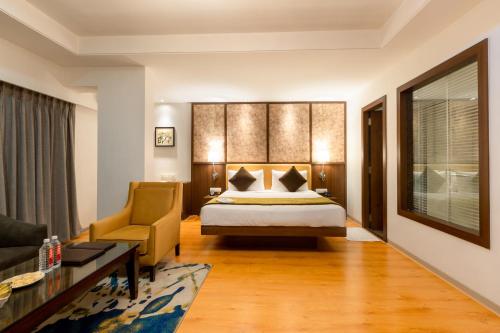 Ένα ή περισσότερα κρεβάτια σε δωμάτιο στο Freesia By Express Inn