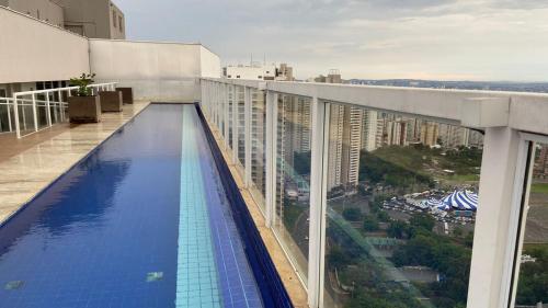 a swimming pool on the roof of a building at Trend 2414 in Goiânia