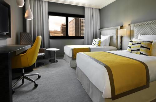 Ein Bett oder Betten in einem Zimmer der Unterkunft Movenpick Hotel Abidjan-Accor Group