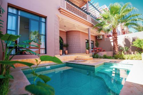a swimming pool in the backyard of a house at The Kozyhome in Ouarzazate