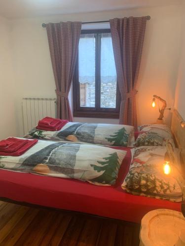 Postel nebo postele na pokoji v ubytování Ul baitin da In Re
