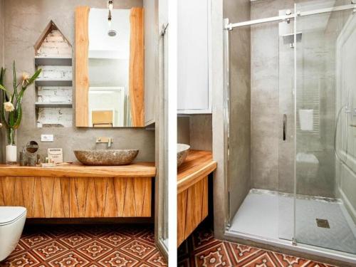 米蘭的住宿－Vallazze Luxury，一间带玻璃淋浴和水槽的浴室