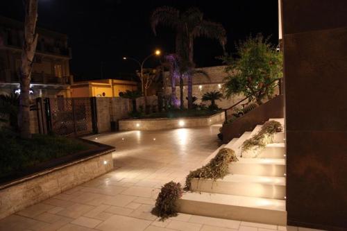 a set of stairs with lights on them at night at B&B Villa Grace in Bari