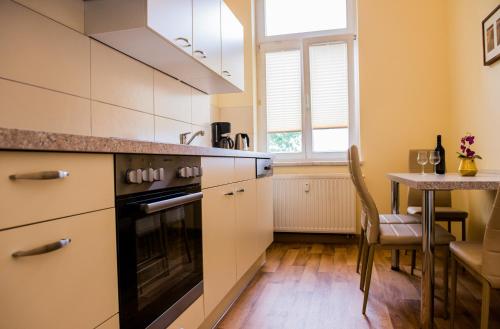 Kuchyň nebo kuchyňský kout v ubytování Apartmenthaus Stadt Metz