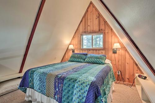a bedroom with a large bed in a attic at Cozy Toledo Bend A-Frame with Waterfront Views! in Burkeville