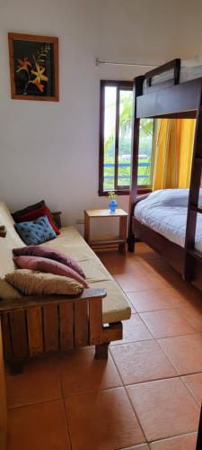 a bedroom with two bunk beds and a tiled floor at Casa Volcano Panoramic View in Vara Blanca