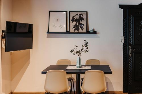 a dining room with a table and chairs at Flasch Appart-Pension in Wagrain
